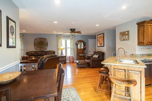 a front view of a house with yard and tree s