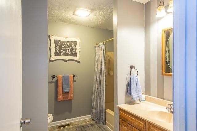 a view of a tree in a yard