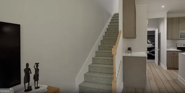 a view of entryway and hall with wooden floor