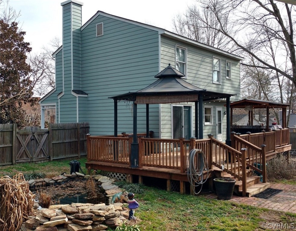3904 Echo Ridge Place Midlothian, VA 23112 - Photo 15 of 26 a view of a house with a yard and wooden deck