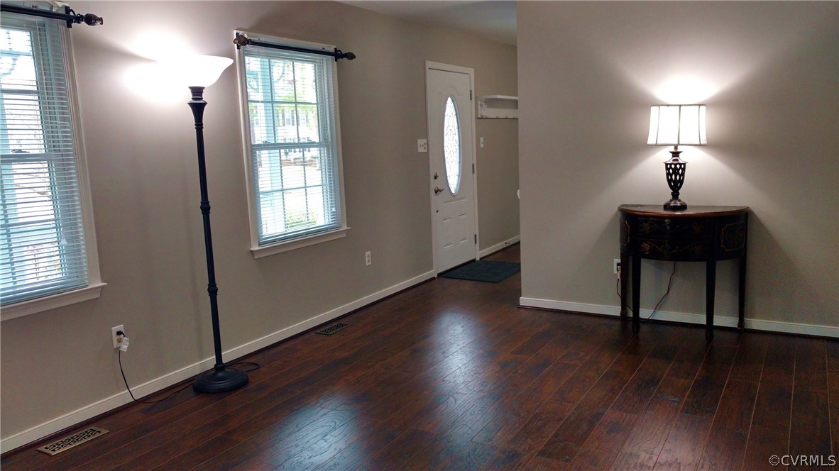 3904 Echo Ridge Place Midlothian, VA 23112 - Photo 2 of 26 an empty room with wooden floor mirror and windows