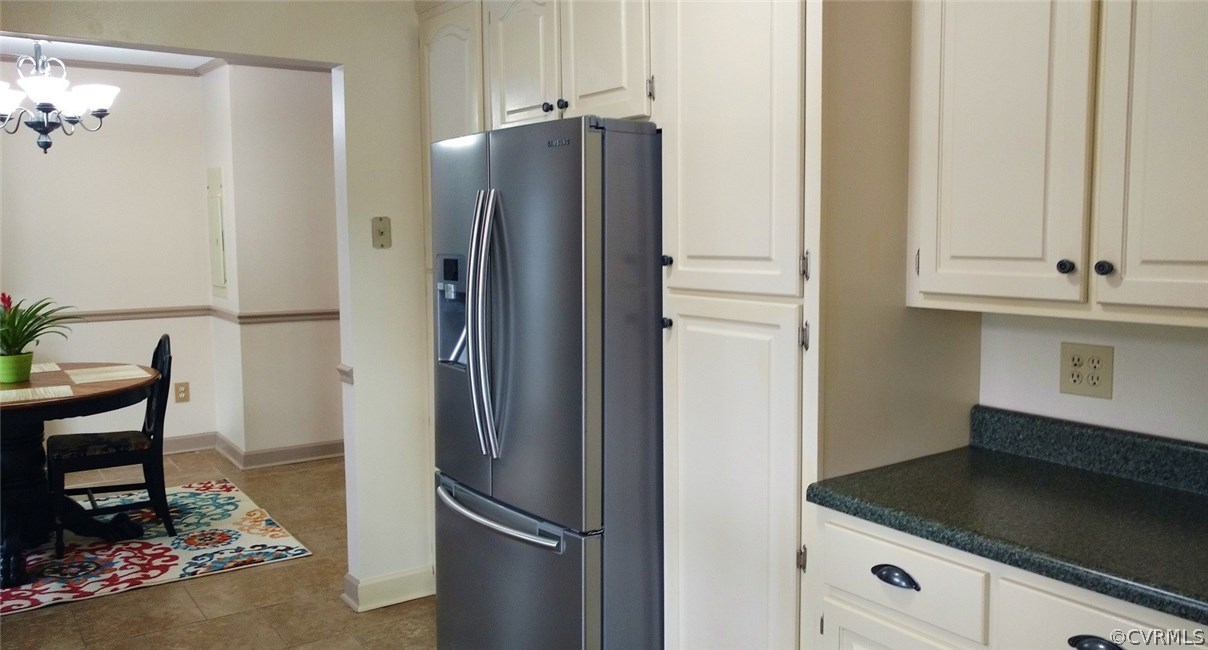 3904 Echo Ridge Place Midlothian, VA 23112 - Photo 7 of 26 a metallic refrigerator freezer sitting in a kitchen