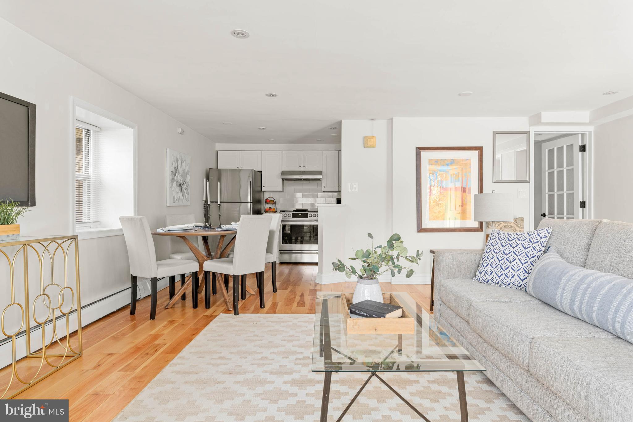 383 Lakeside Road, Unit G2 Ardmore, PA 19003 - Photo 3 of 16 a living room with lots of furniture and wooden floor