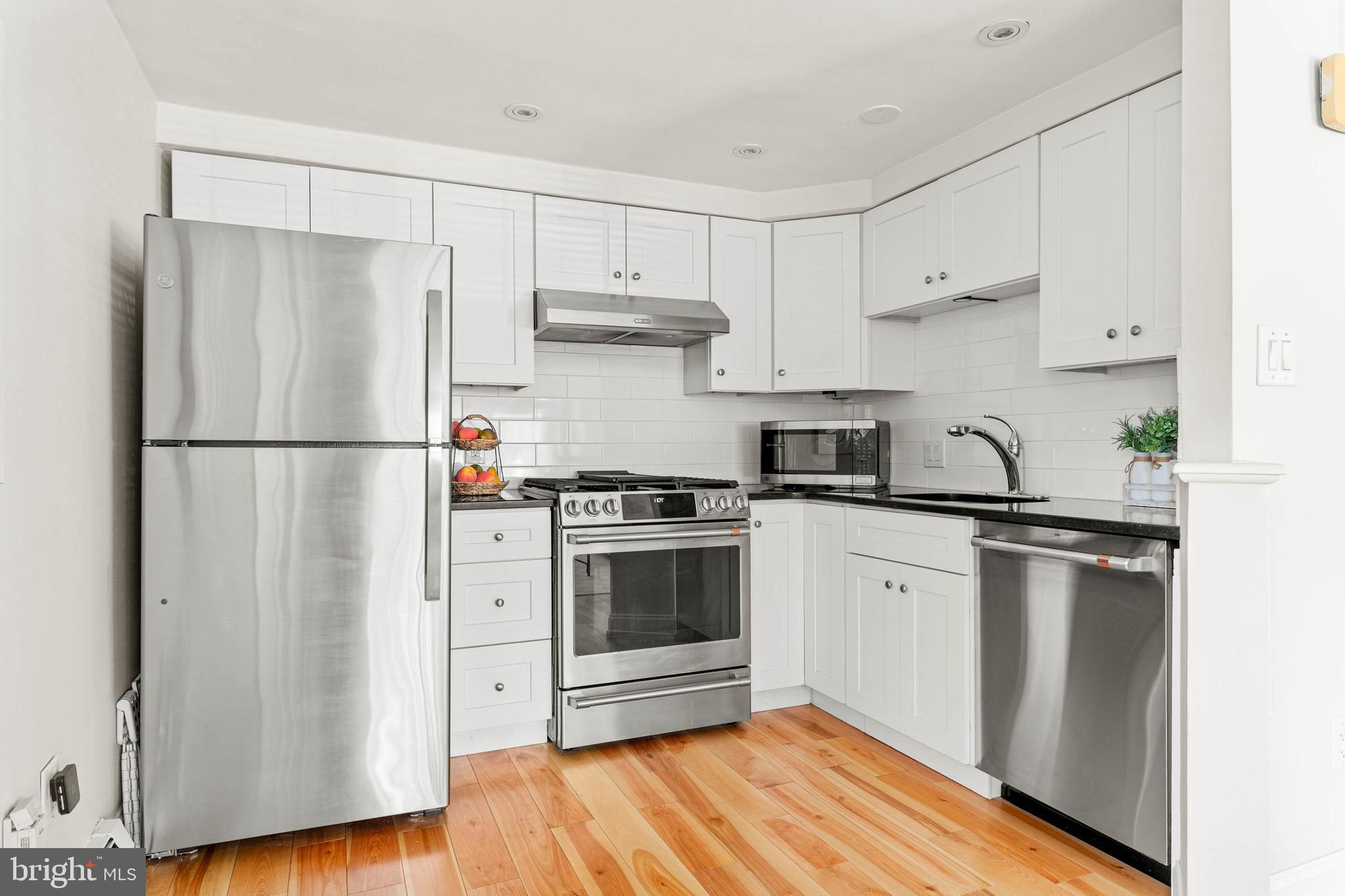 383 Lakeside Road, Unit G2 Ardmore, PA 19003 - Photo 4 of 16 a kitchen with stainless steel appliances a refrigerator sink and cabinets