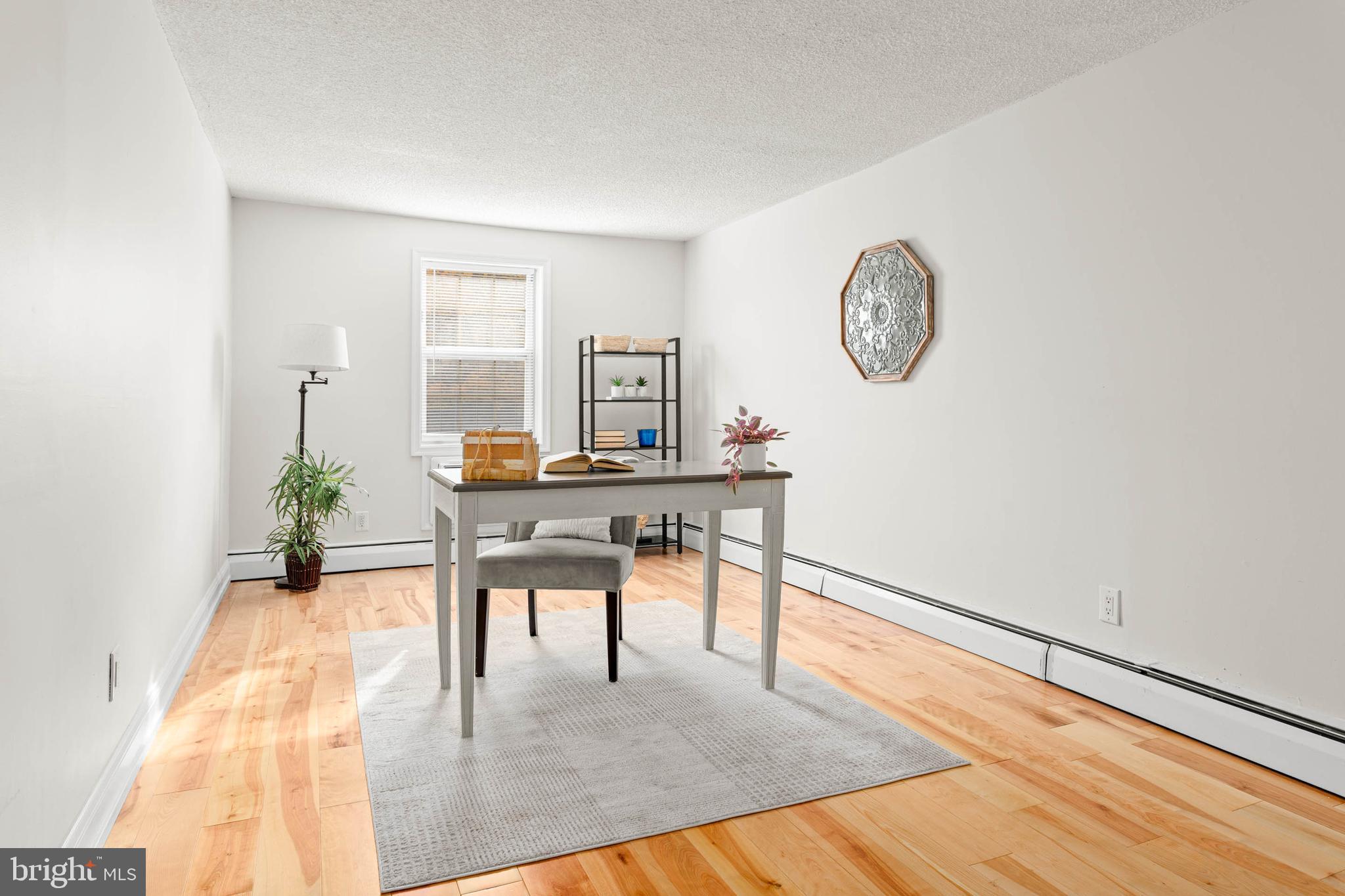 383 Lakeside Road, Unit G2 Ardmore, PA 19003 - Photo 7 of 16 a living room with furniture and a table