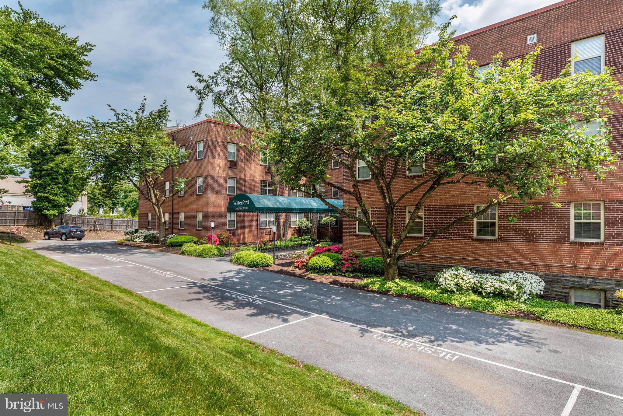 383 Lakeside Road, Unit G2 Ardmore, PA 19003 - Photo 9 of 16 a front view of a house with garden