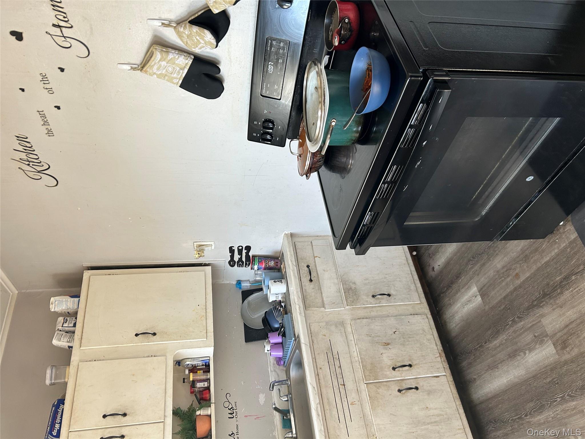 1 Gray Street Poughkeepsie, NY 12603 - Photo 19 of 22 a kitchen with a stove and cabinets