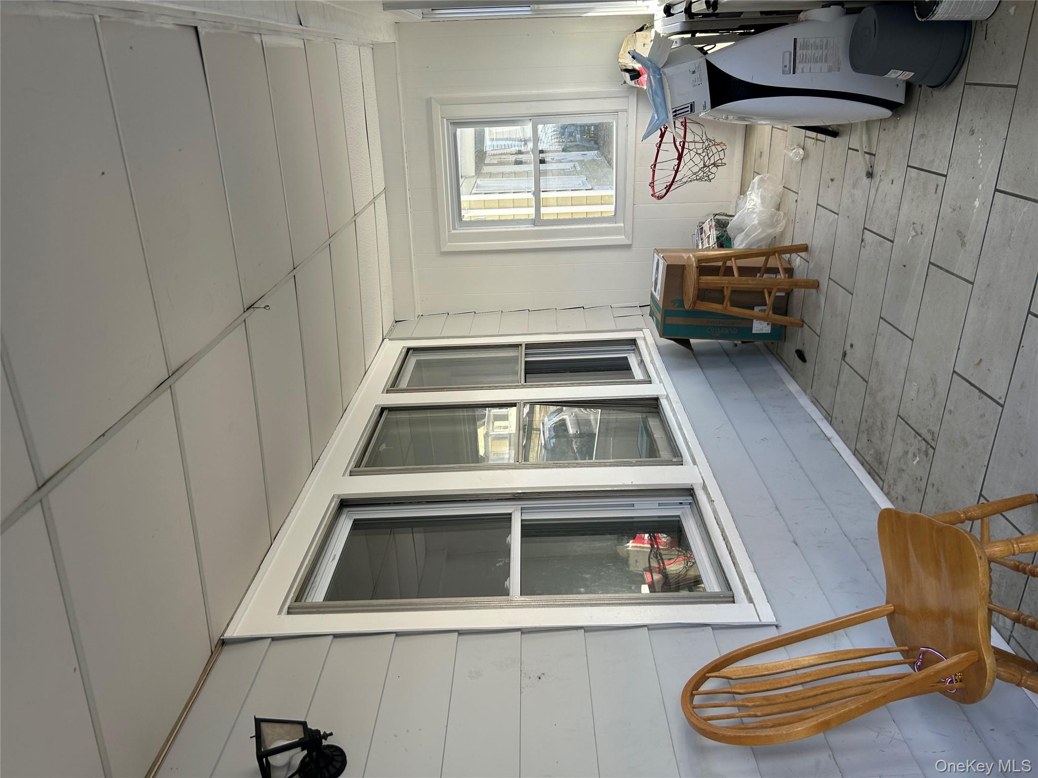 1 Gray Street Poughkeepsie, NY 12603 - Photo 2 of 22 a living room with furniture and two large window