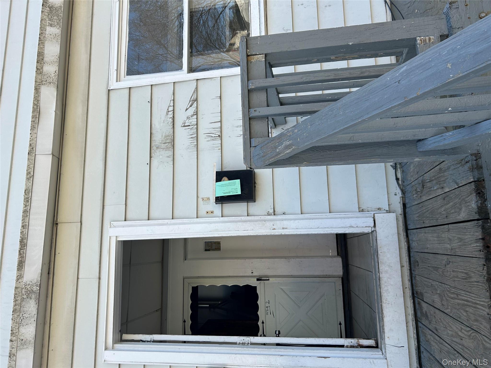 1 Gray Street Poughkeepsie, NY 12603 - Photo 3 of 22 a view of a hallway with wooden floor and staircase