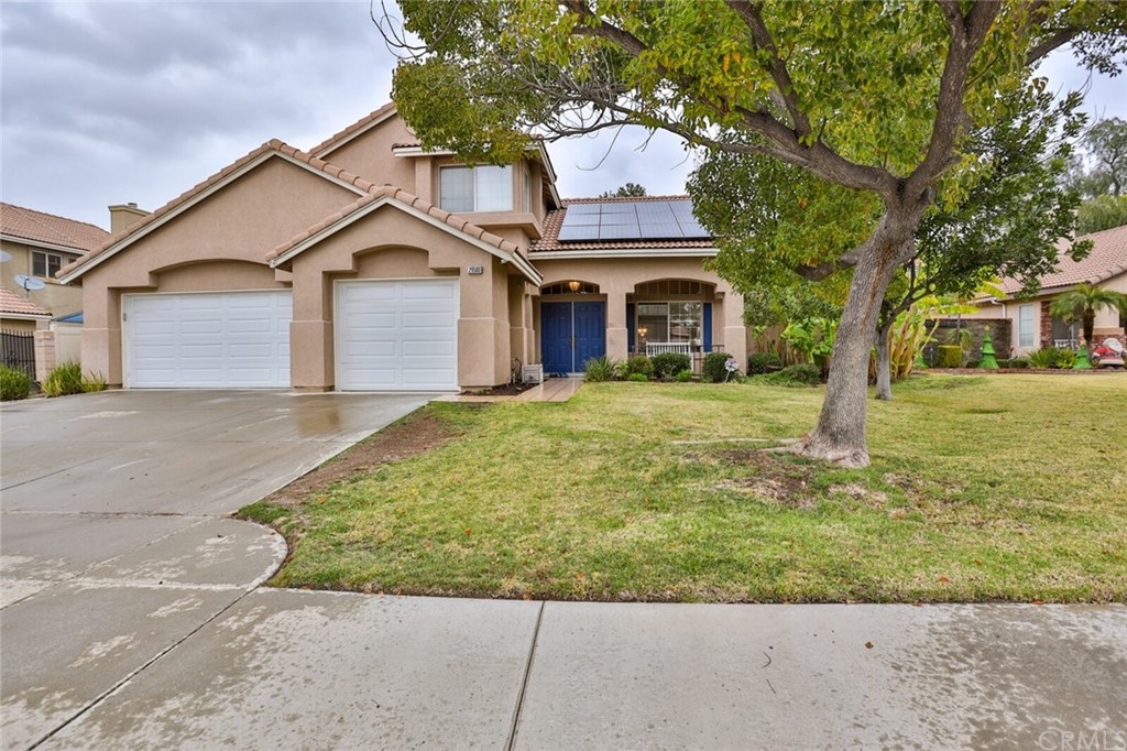 29580 Chandler Road Highland, CA 92346 - Photo 1 of 1 a front view of a house with a yard garage and outdoor seating