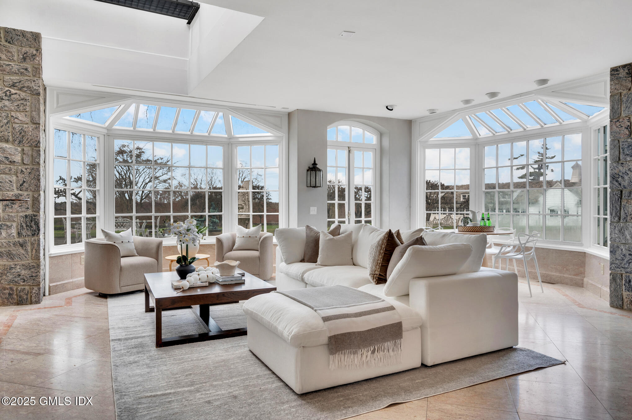 5-7 John Street Greenwich, CT 06831 - Photo 11 of 28 a living room with furniture and a large window