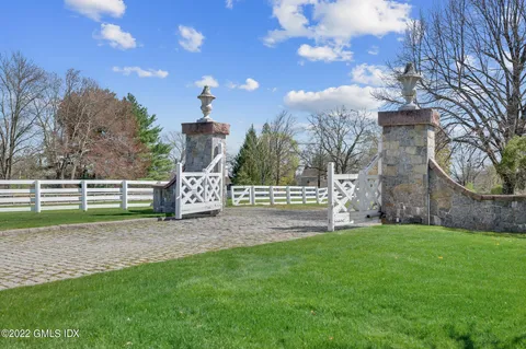 a view of a wooden fence and a yard
