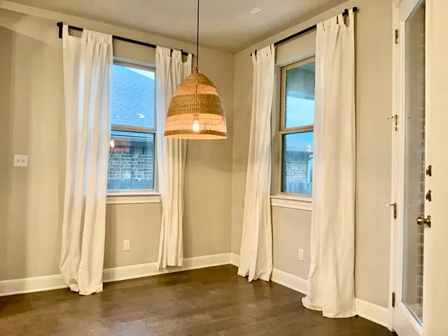 a bathroom with a glass shower door and a sink