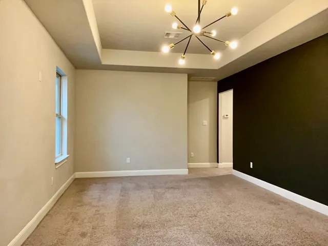 a view of a livingroom with a ceiling fan and window
