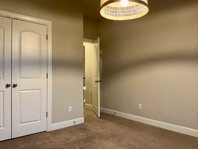 an empty room with a mirror