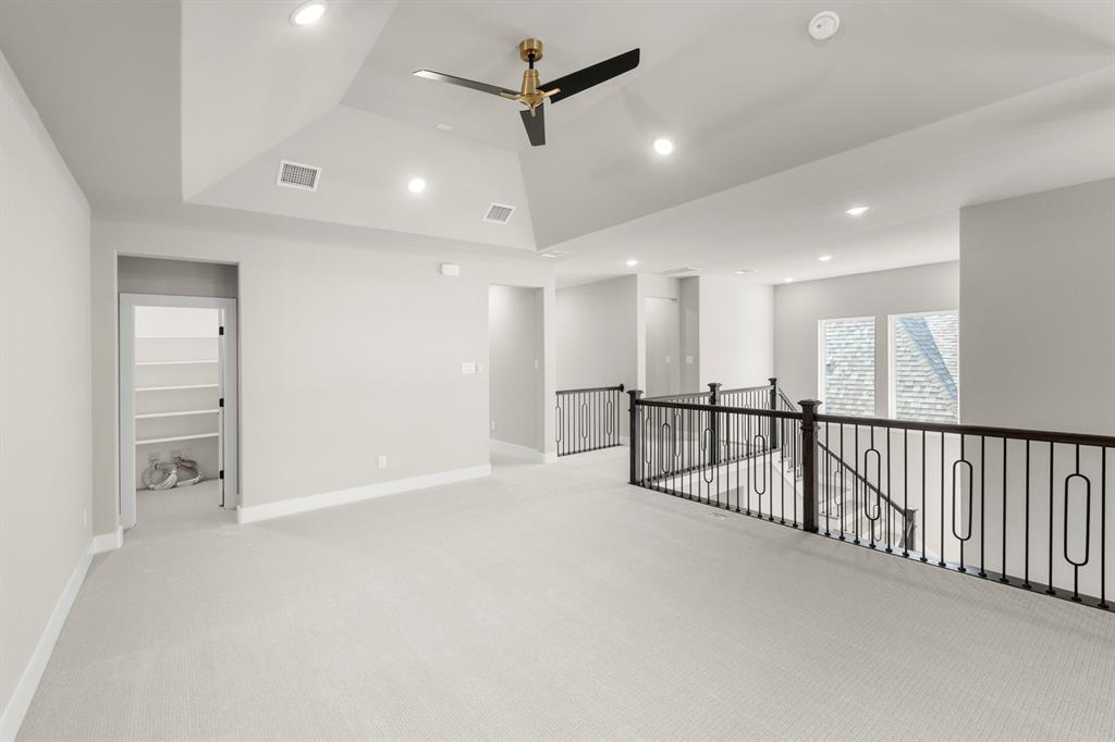 4512 Meander Way Prosper, TX 75078 - Photo 24 of 39 a view of a hallway with a ceiling fan