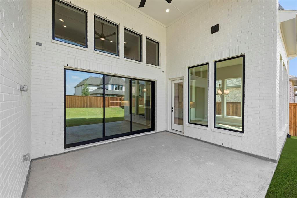 4512 Meander Way Prosper, TX 75078 - Photo 29 of 39 a view of an empty room with sliding glass door and windows