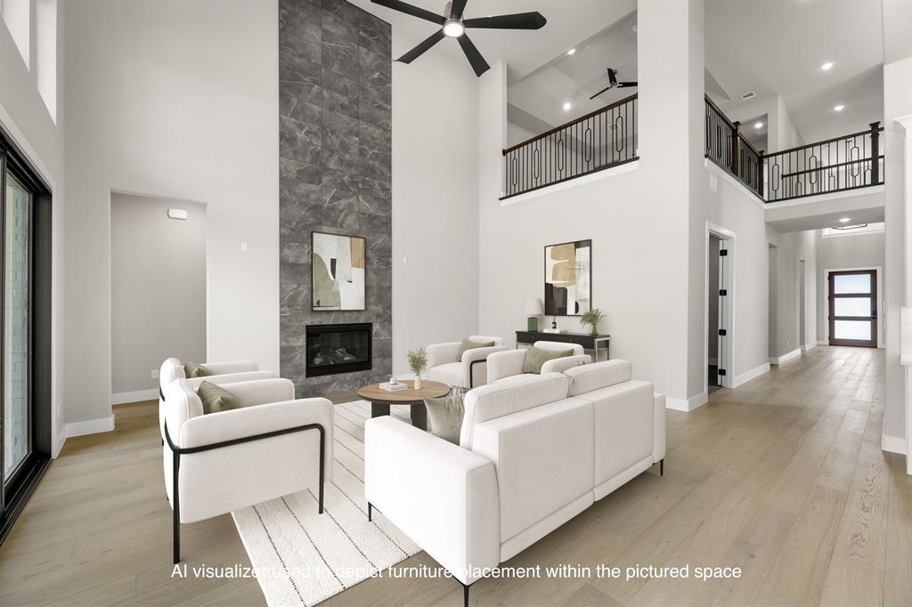 4512 Meander Way Prosper, TX 75078 - Photo 3 of 39 a living room with furniture and a fireplace