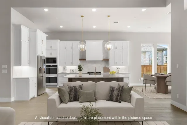 a living room with stainless steel appliances kitchen view and living room