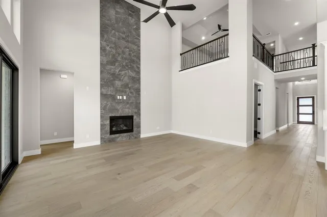 a view of a livingroom with a fireplace and cabinet