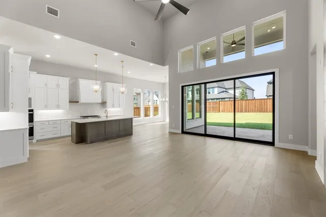 a view of a kitchen with a sink and a window