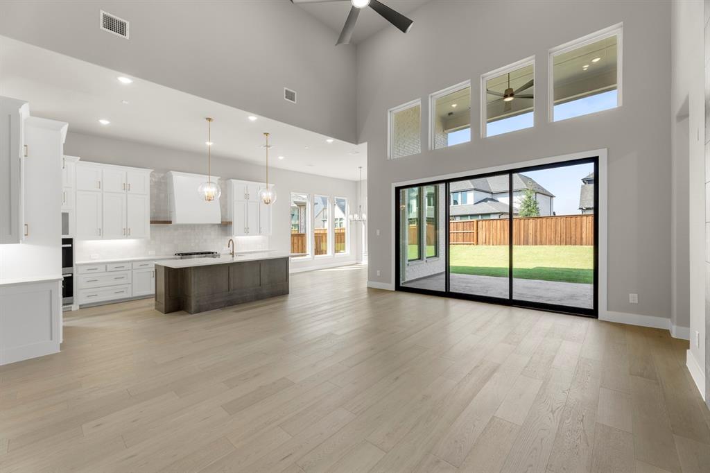 4512 Meander Way Prosper, TX 75078 - Photo 10 of 39 a view of a kitchen with a sink and a window