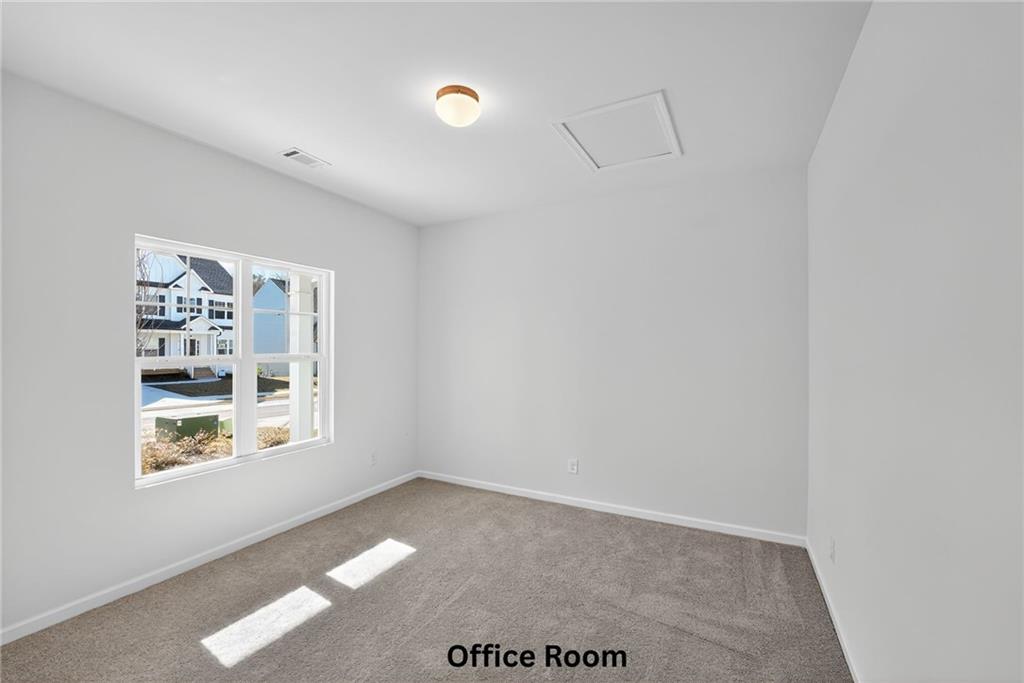 233 Bloomfield Circle Canton, GA 30114 - Photo 15 of 22 an empty room with windows