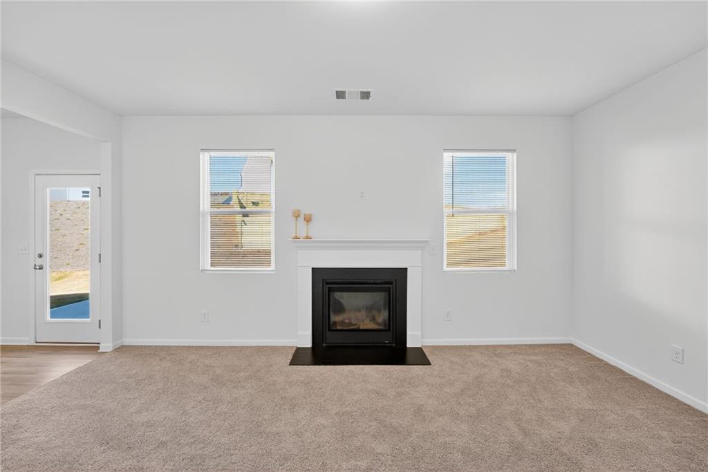 233 Bloomfield Circle Canton, GA 30114 - Photo 7 of 22 a room with a fireplace