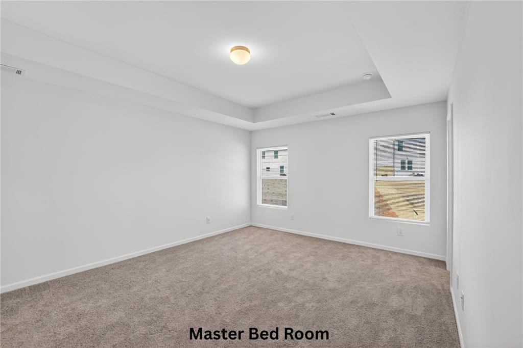 233 Bloomfield Circle Canton, GA 30114 - Photo 10 of 22 an empty room with windows