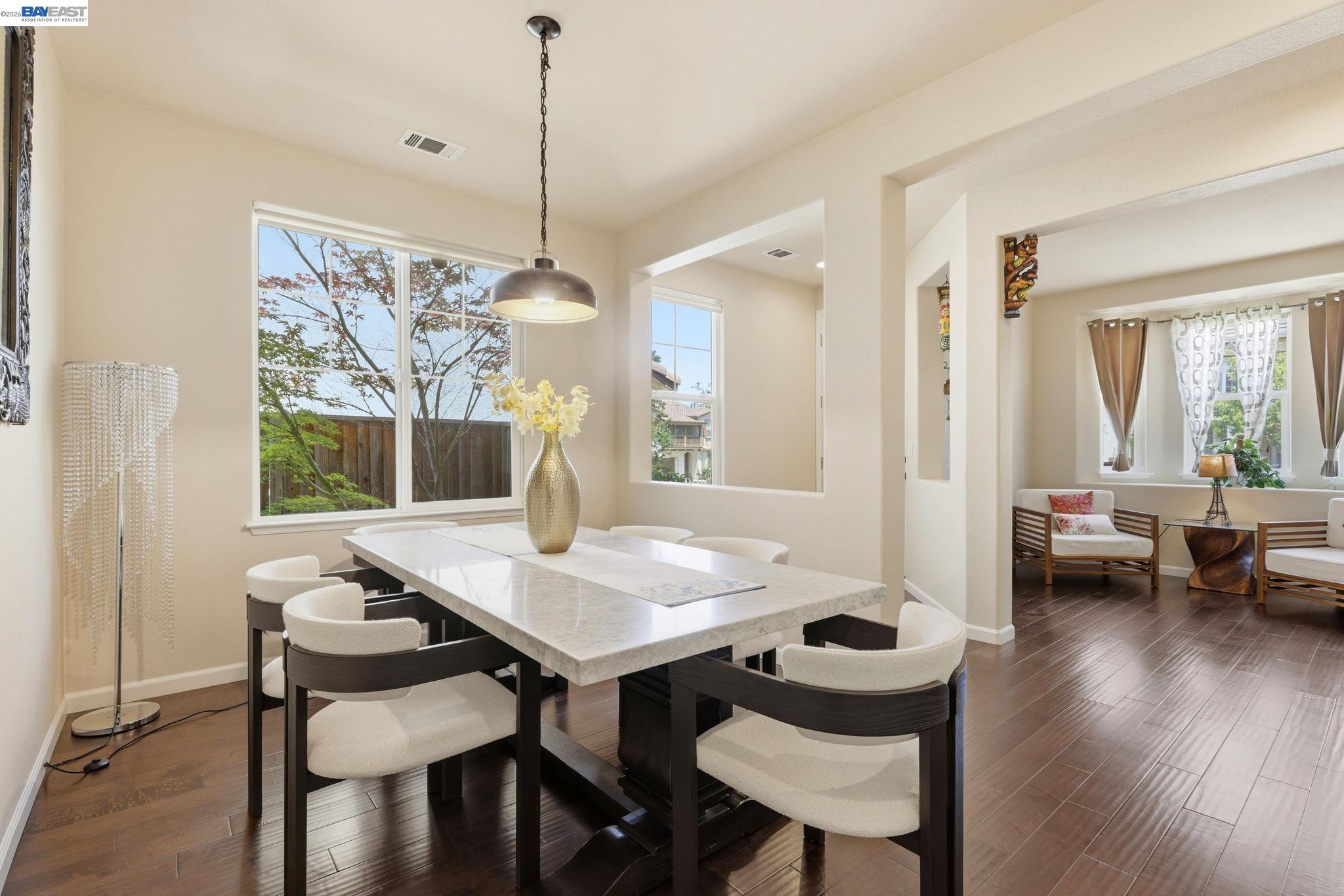 5029 Queensbury Way San Ramon, CA 94582 - Photo 15 of 58 a view of a dining room with furniture window and wooden floor