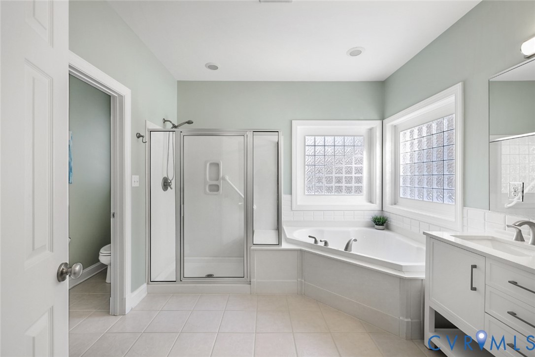 8901 First Branch Lane Chesterfield, VA 23838 - Photo 17 of 38 The first-floor primary suite is spacious and incl