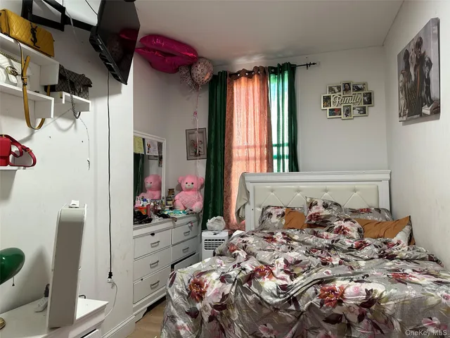 a bed room with a bed and a window