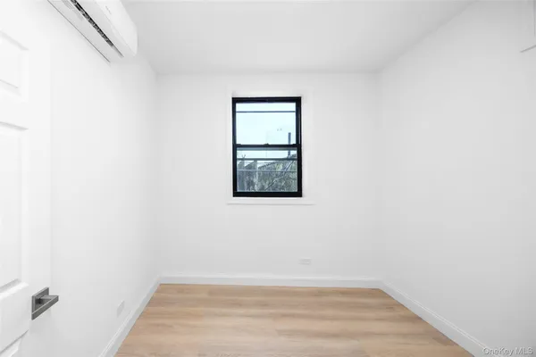 a view of an empty room with closet