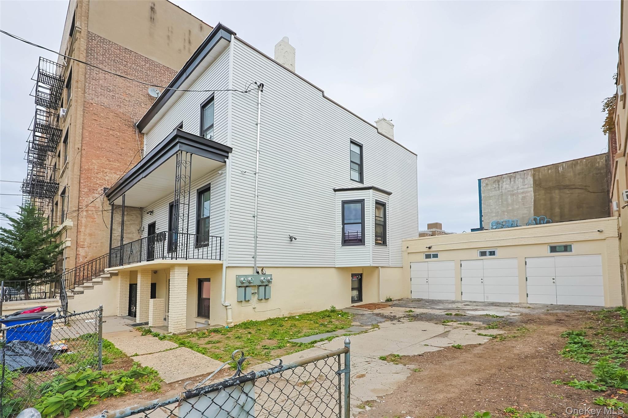 2064 Bathgate Avenue Bronx, NY 10457 - Photo 4 of 14 a view of a house with a yard