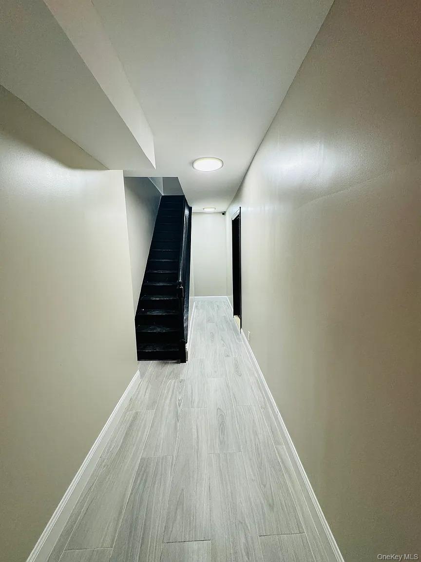 2064 Bathgate Avenue Bronx, NY 10457 - Photo 10 of 14 a view of a room with wooden floor