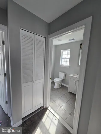 a bathroom with a toilet and a sink