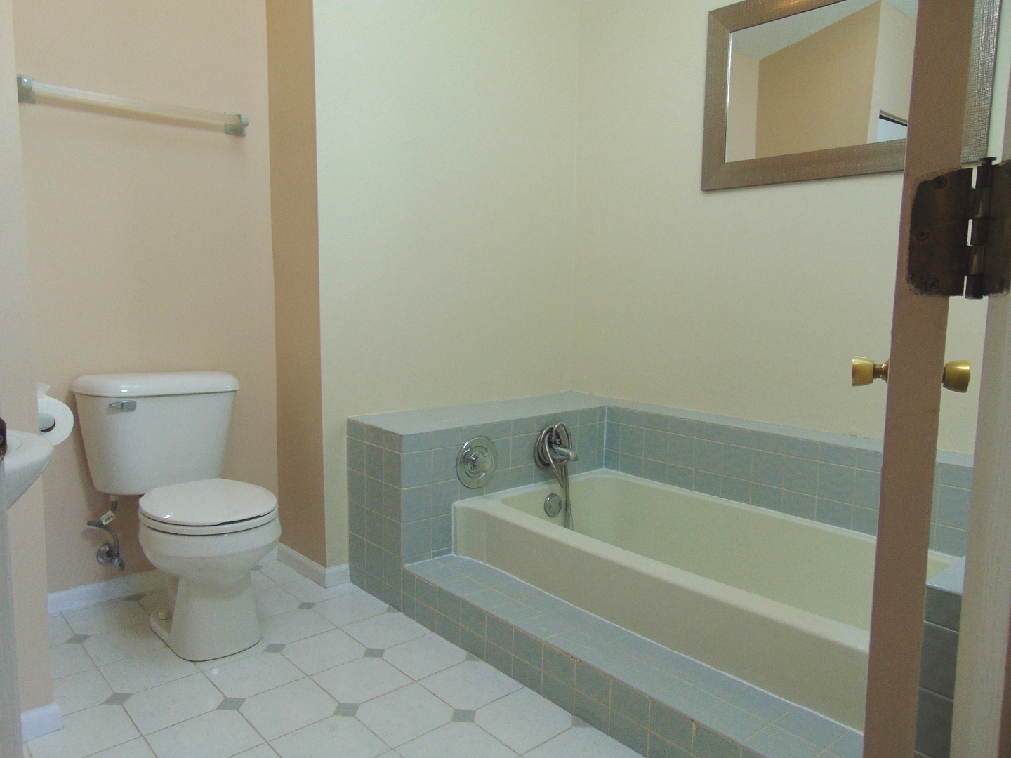 1662 Commodore Court, Unit 2 Schaumburg, IL 60193 - Photo 18 of 26 a white toilet sitting next to a bath tub