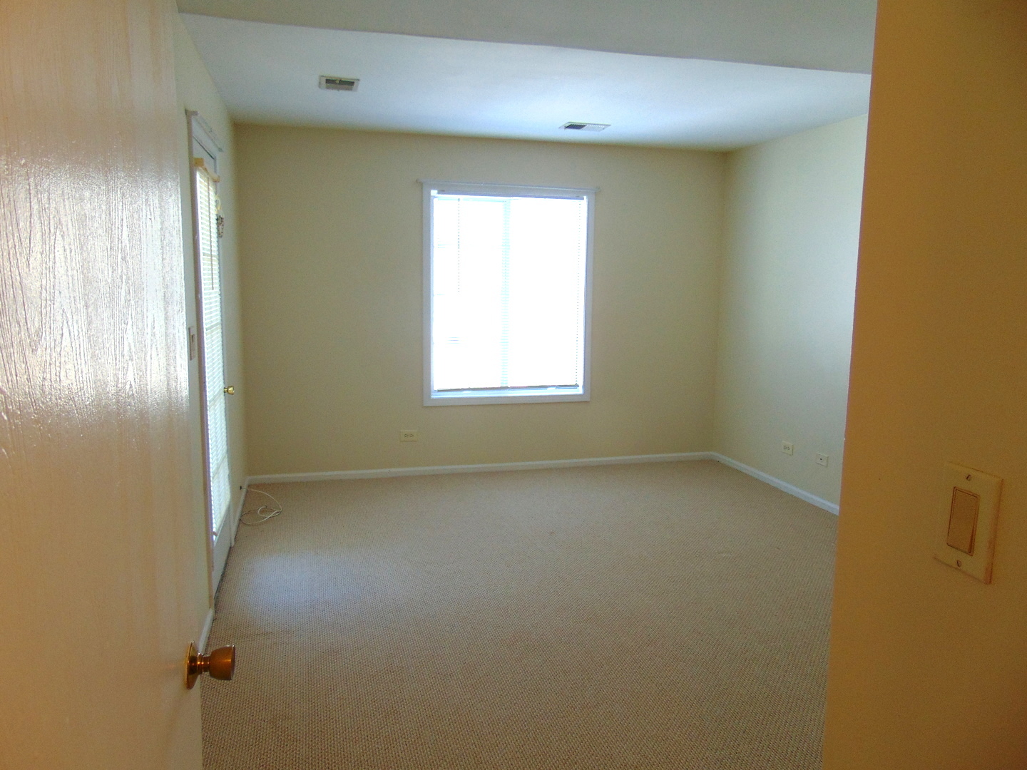 1662 Commodore Court, Unit 2 Schaumburg, IL 60193 - Photo 21 of 26 an empty room with windows