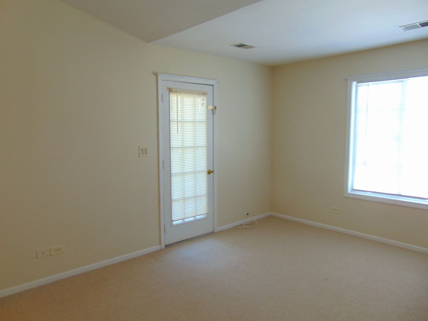 1662 Commodore Court, Unit 2 Schaumburg, IL 60193 - Photo 22 of 26 an empty room with windows
