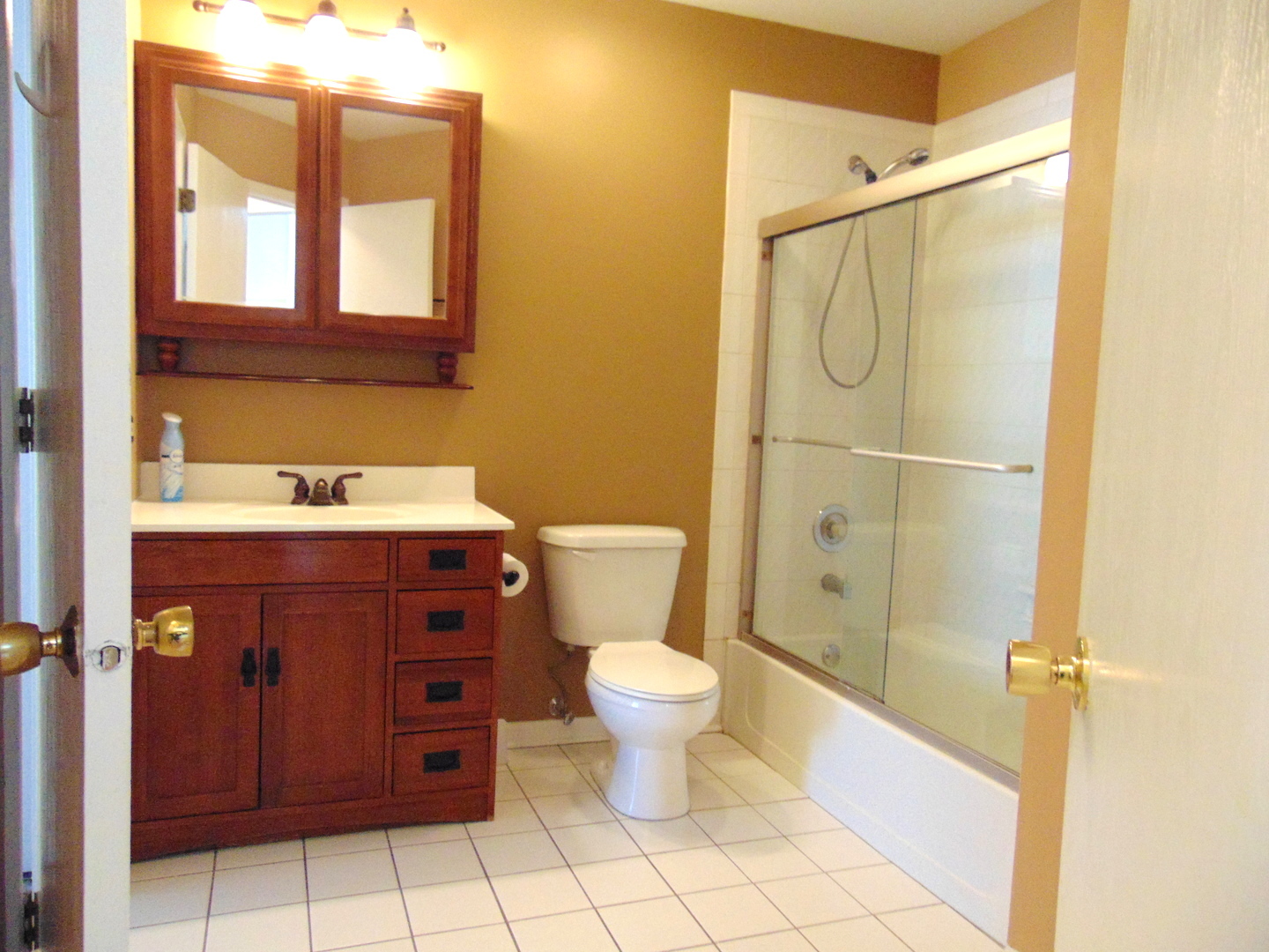 1662 Commodore Court, Unit 2 Schaumburg, IL 60193 - Photo 24 of 26 a bathroom with a sink a toilet and shower