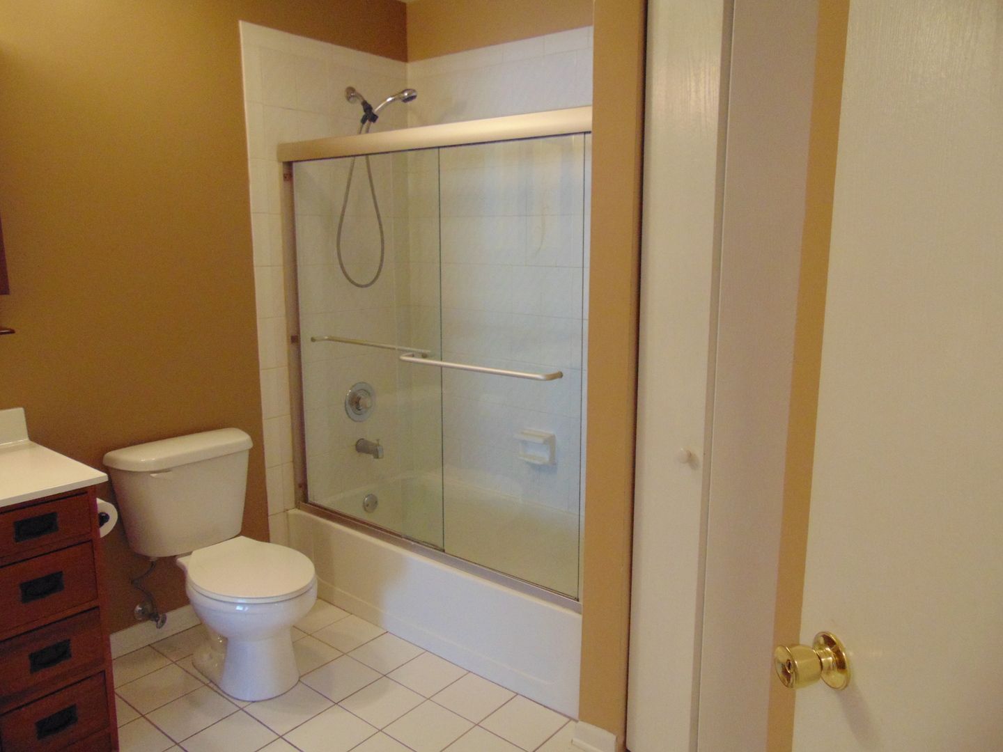 1662 Commodore Court, Unit 2 Schaumburg, IL 60193 - Photo 25 of 26 a bathroom with a toilet and a shower