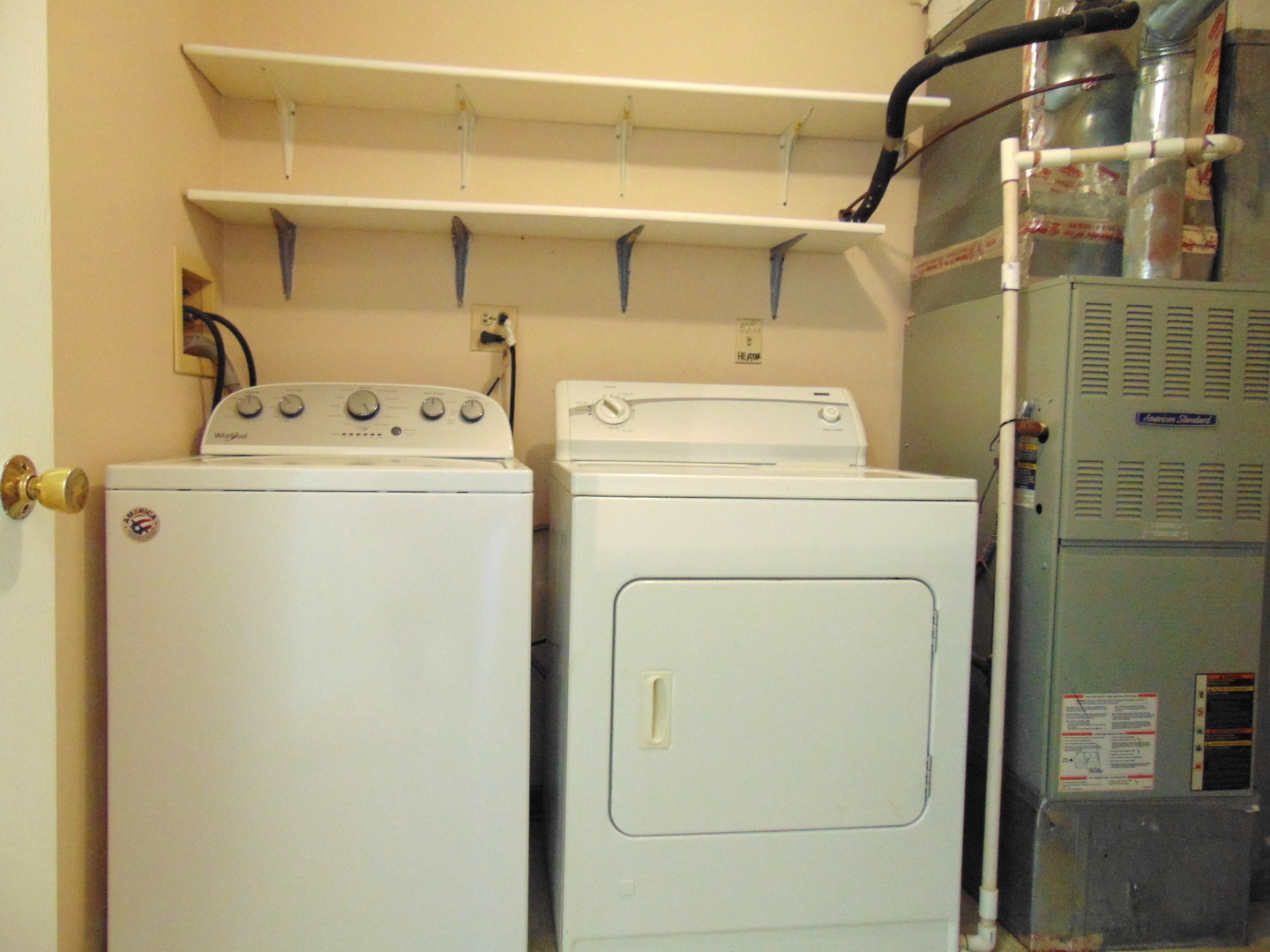 1662 Commodore Court, Unit 2 Schaumburg, IL 60193 - Photo 26 of 26 a utility room with dryer and washer