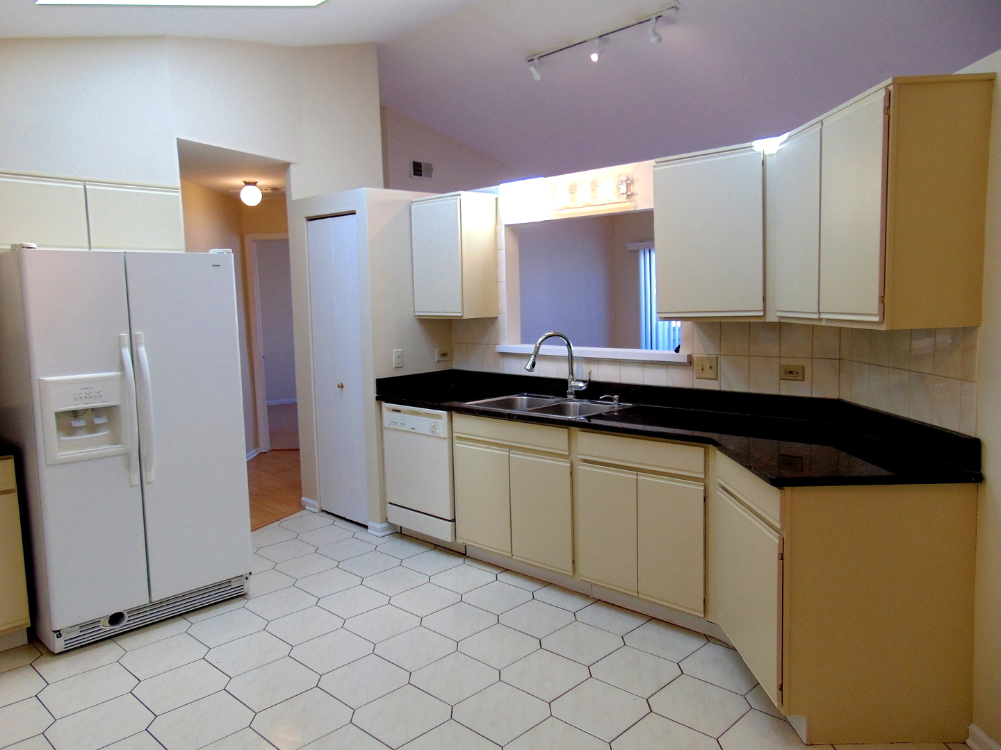 1662 Commodore Court, Unit 2 Schaumburg, IL 60193 - Photo 3 of 26 a kitchen with a sink and cabinets