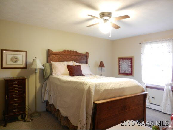 91 River Rdg Road Verona, VA 24482 - Photo 9 of 20 a bedroom with a bed and a chandelier