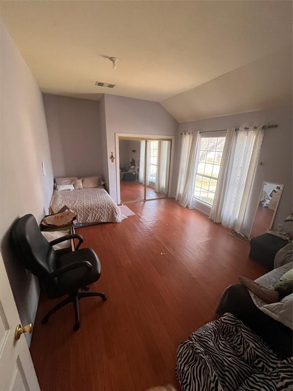 4838 Wisteria Street Dallas, TX 75211 - Photo 15 of 19 a living room with furniture and a hard wood floor