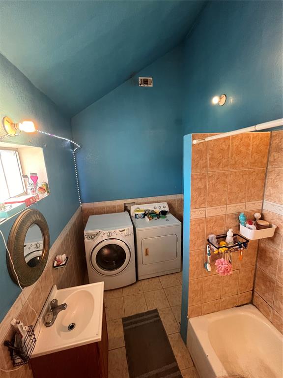 4838 Wisteria Street Dallas, TX 75211 - Photo 17 of 19 a bathroom with a toilet a sink and a mirror