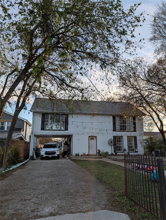 4838 Wisteria Street Dallas, TX 75211 - Photo 2 of 19 a view of a car park in front of house