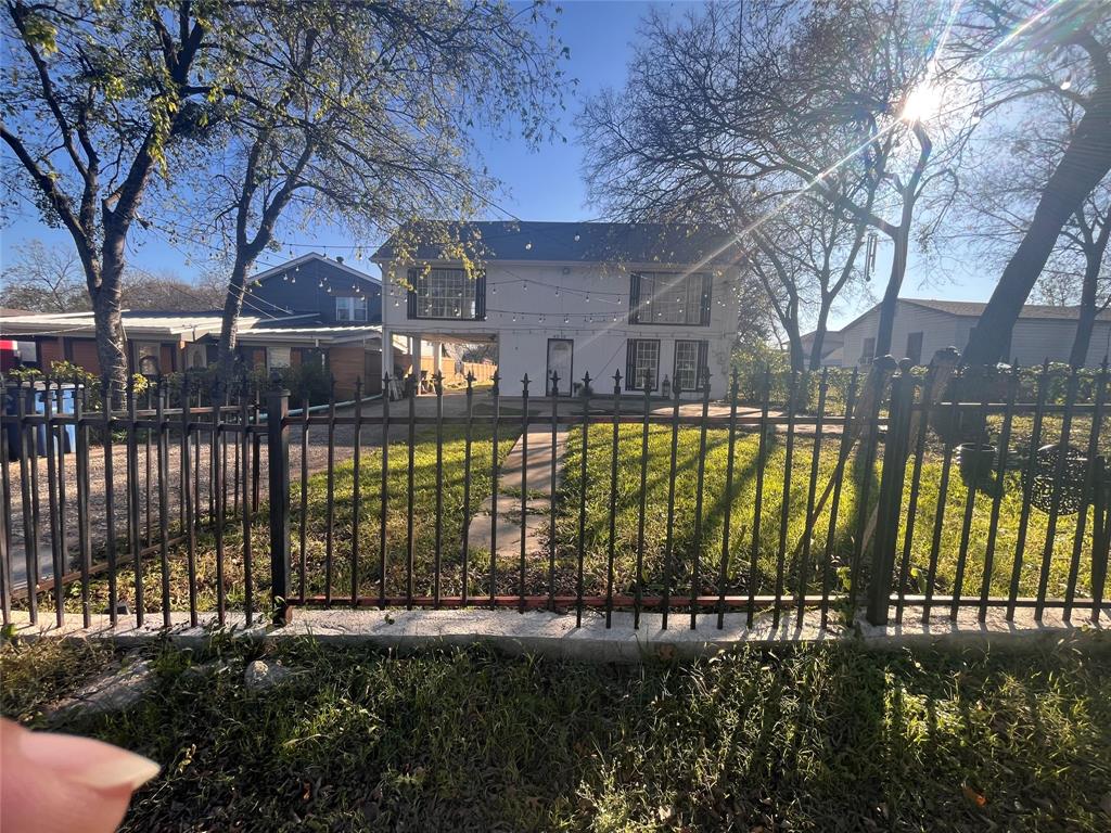 4838 Wisteria Street Dallas, TX 75211 - Photo 5 of 19 a view of swimming pool with a garden