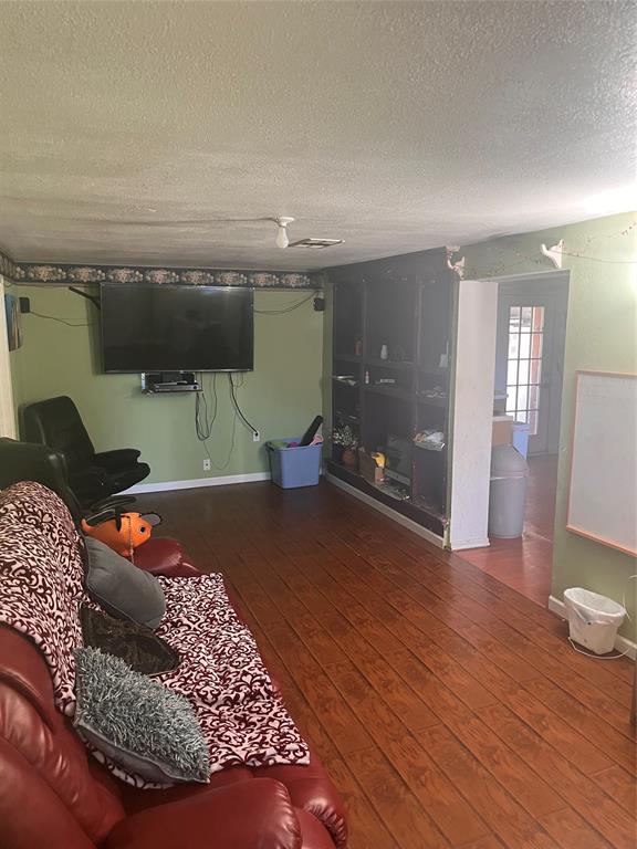 4838 Wisteria Street Dallas, TX 75211 - Photo 8 of 19 wooden floor in a an empty room