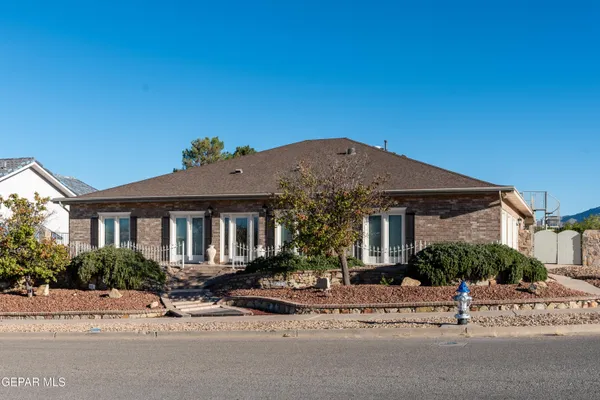 a view of a house with a street